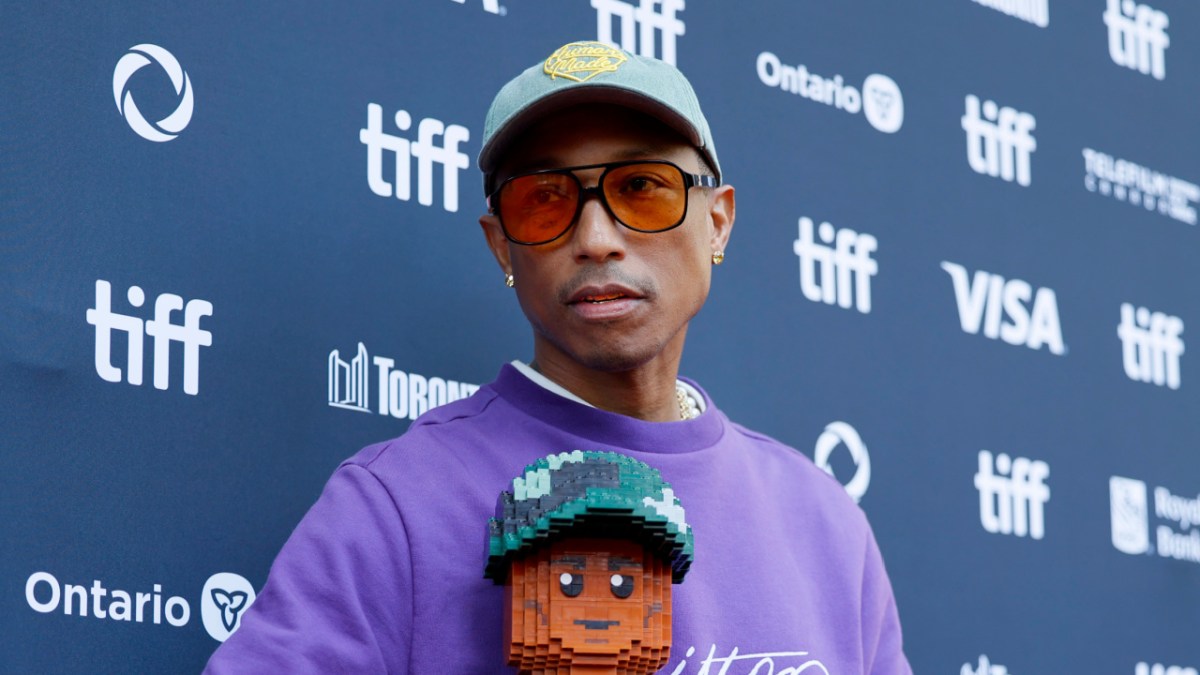 Pharrell Confronted By Animal Rights Activist At LEGO Movie Premiere