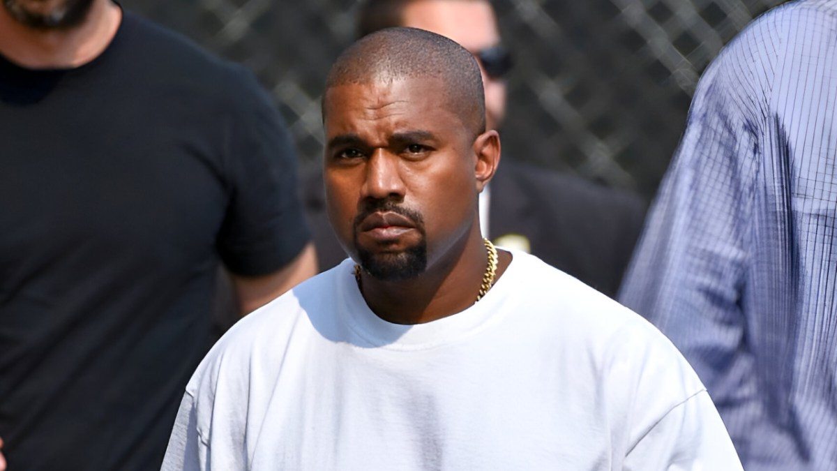 Kanye West Stares Down Paparazzi While Stepping Out In Swastika T-Shirt